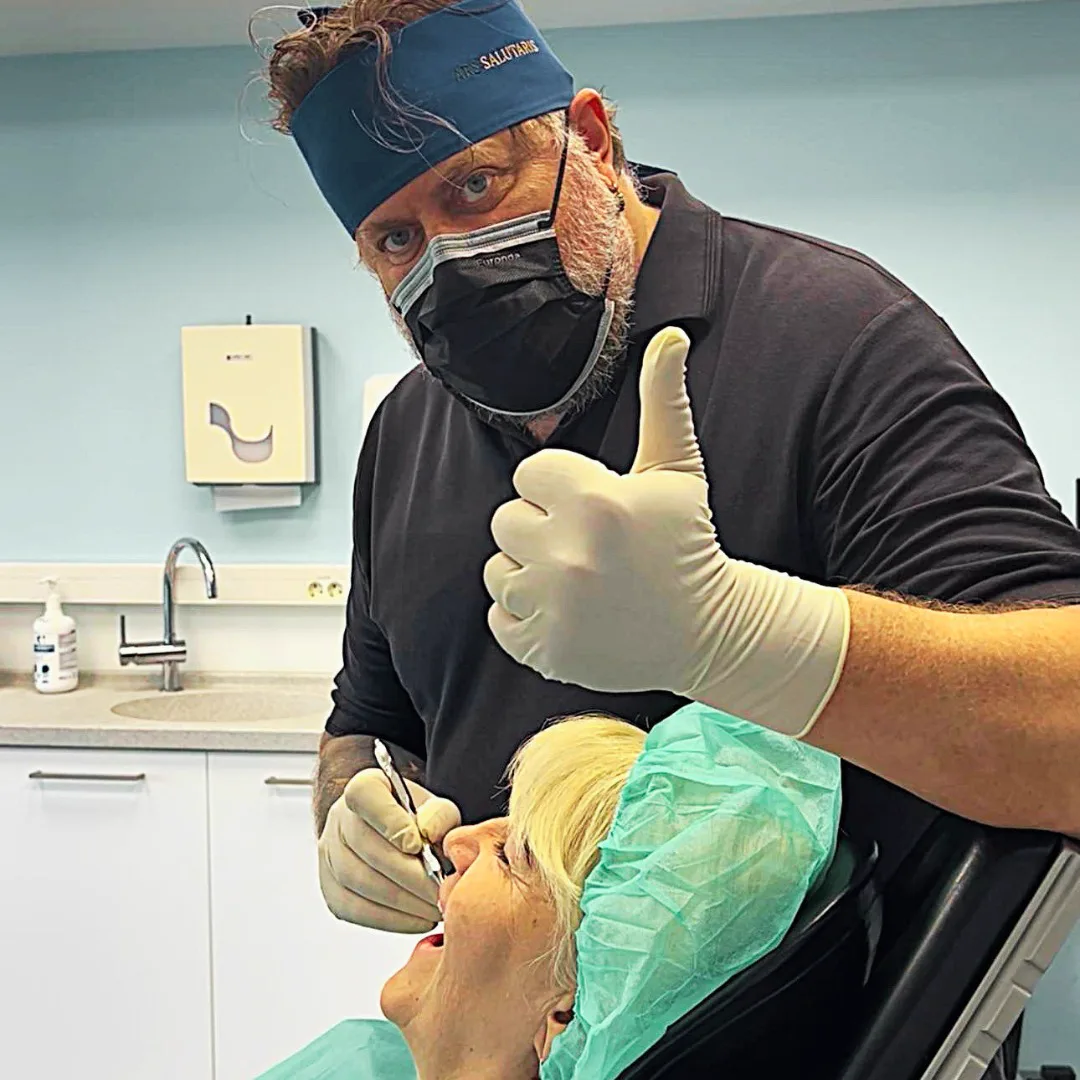 Implant surgeon with a patient in the chair at Ars Salutaris