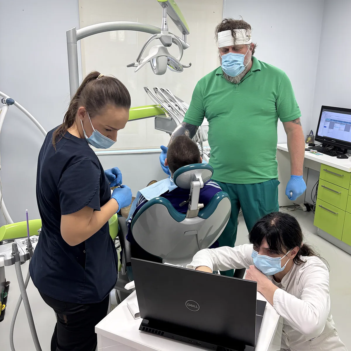 Specialist team performing an implant treatment at the clinic
