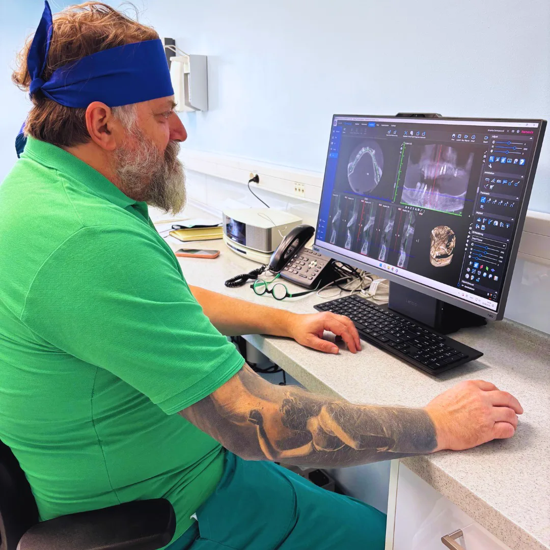 Dentist analysing a 3D CBCT scan ahead of implant planning