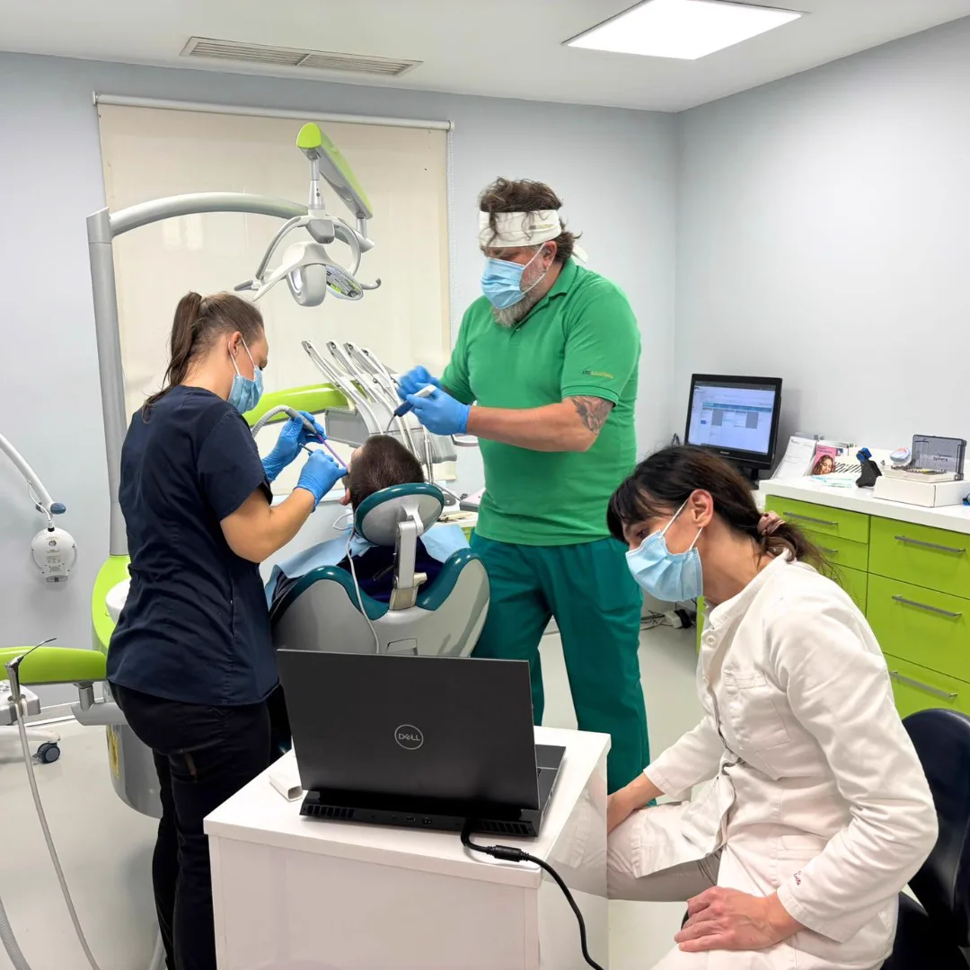 The dental team during an ongoing treatment in the operatory